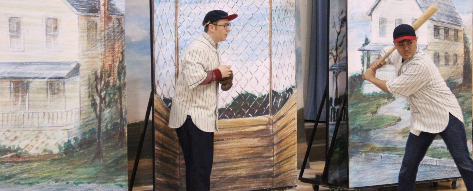 A performance at 5th Avenue Theater in Seattle shows two people playing baseball.
