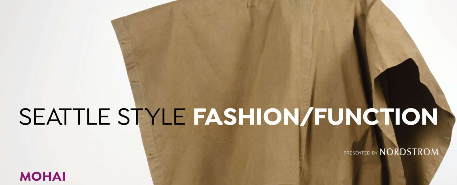 A brown poncho with "Seattle Style Fashion/Function" overlaid.