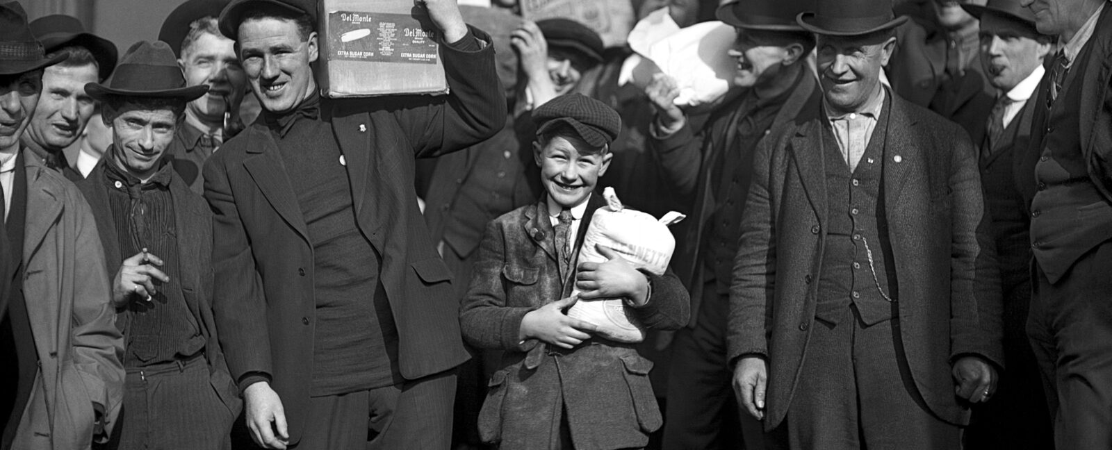 A group of men and a boy carrying groceries during the Seattle general strike