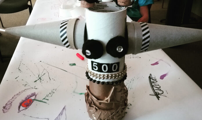 A Maker Day creation comprised of recycled paper products