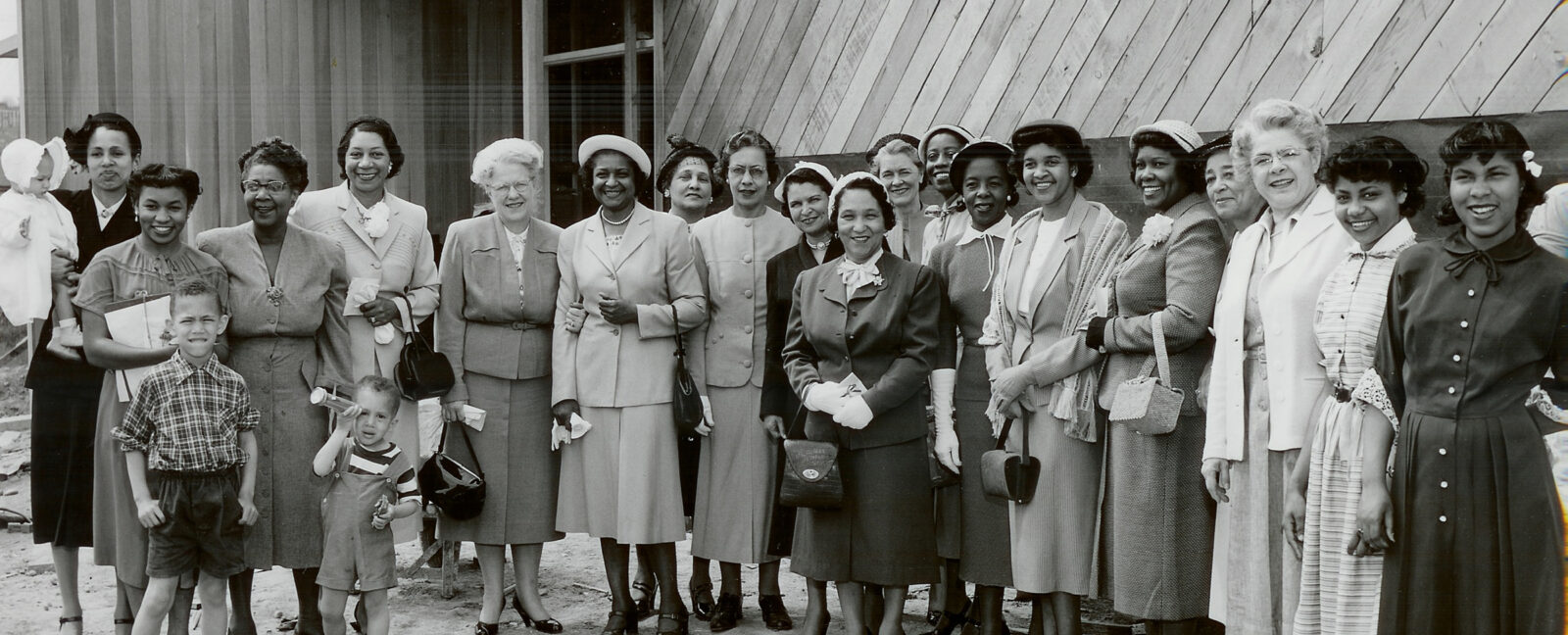 Historic YWCA photo featuring a group of mostly African American women and three children.