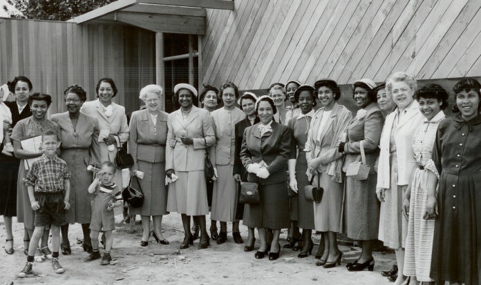 Historic YWCA photo featuring a group of mostly African American women and three children.