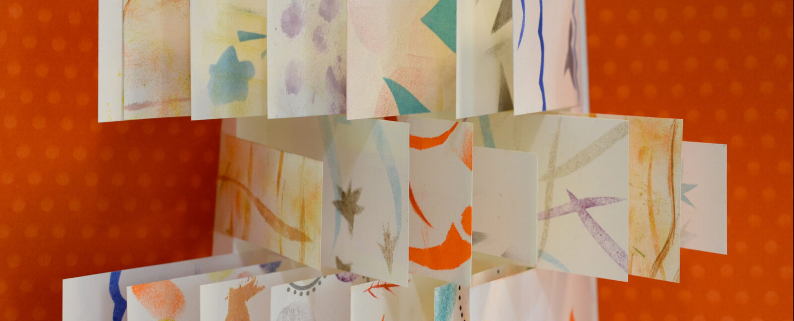 Folded paper with colorful designs.