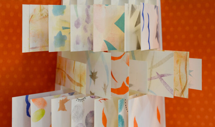 Folded paper with colorful designs.