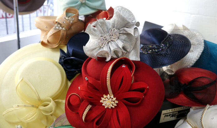 A pile of colorful hats (red