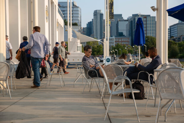 Patrons of Gourmondo at MOHAI relax on the Boeing Centennial Terrace overlooking Lake Union in downtown Seattle, WA.