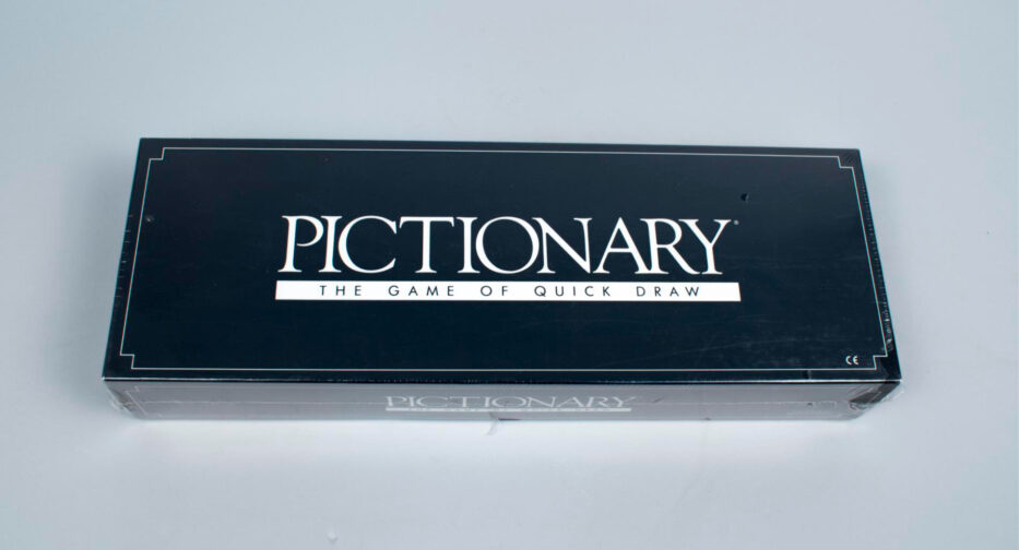 A board game in a closed black box labeled “Pictionary: The Game of Quick Draw.”