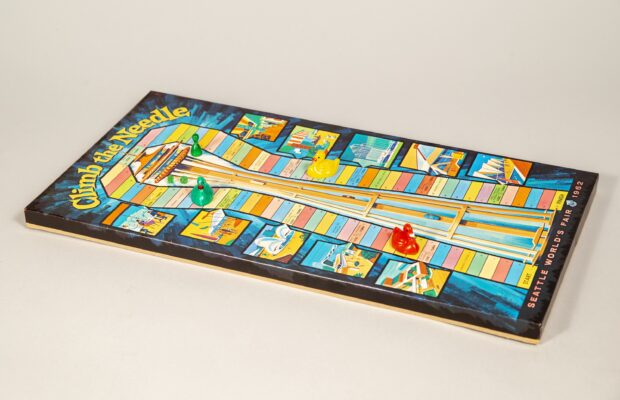 A retro board game shaped like the Space Needle, inspired by the 1962 World's Fair.