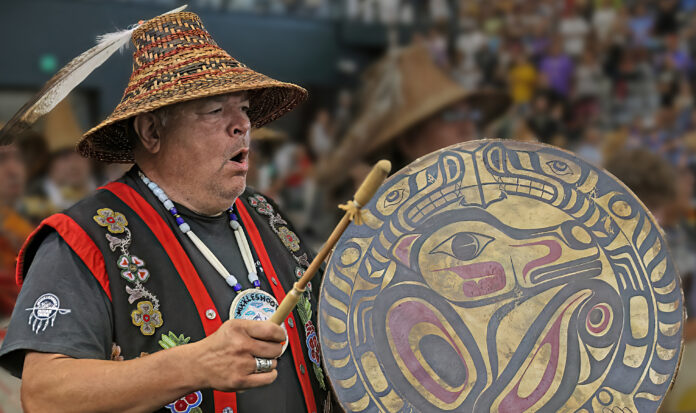 John Halliday playing a Native American drum