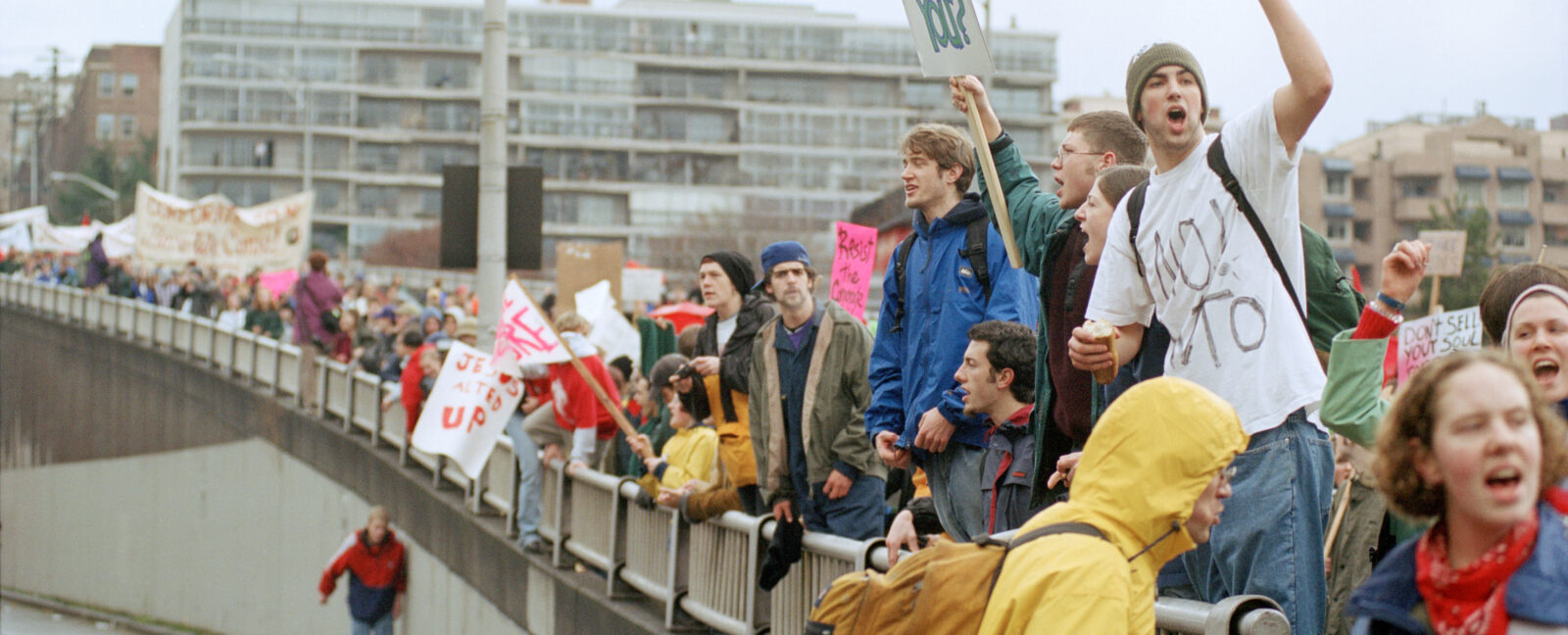 Individuals lined up at the WTO protests in Seattle, WA in 1999.