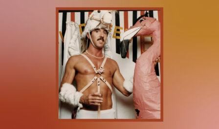Ric Weiland standing next to a pink flamingo.