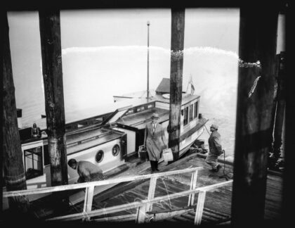 Roy Olmstead stepping off a boat at Steilacoom landing in 1931, the day of his release from McNeil Island Penitentiary after serving time for bootlegging.