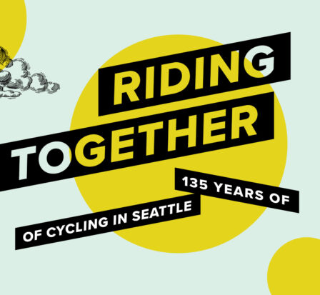 A group of cyclists pedaling off a ferry in Seattle, WA.