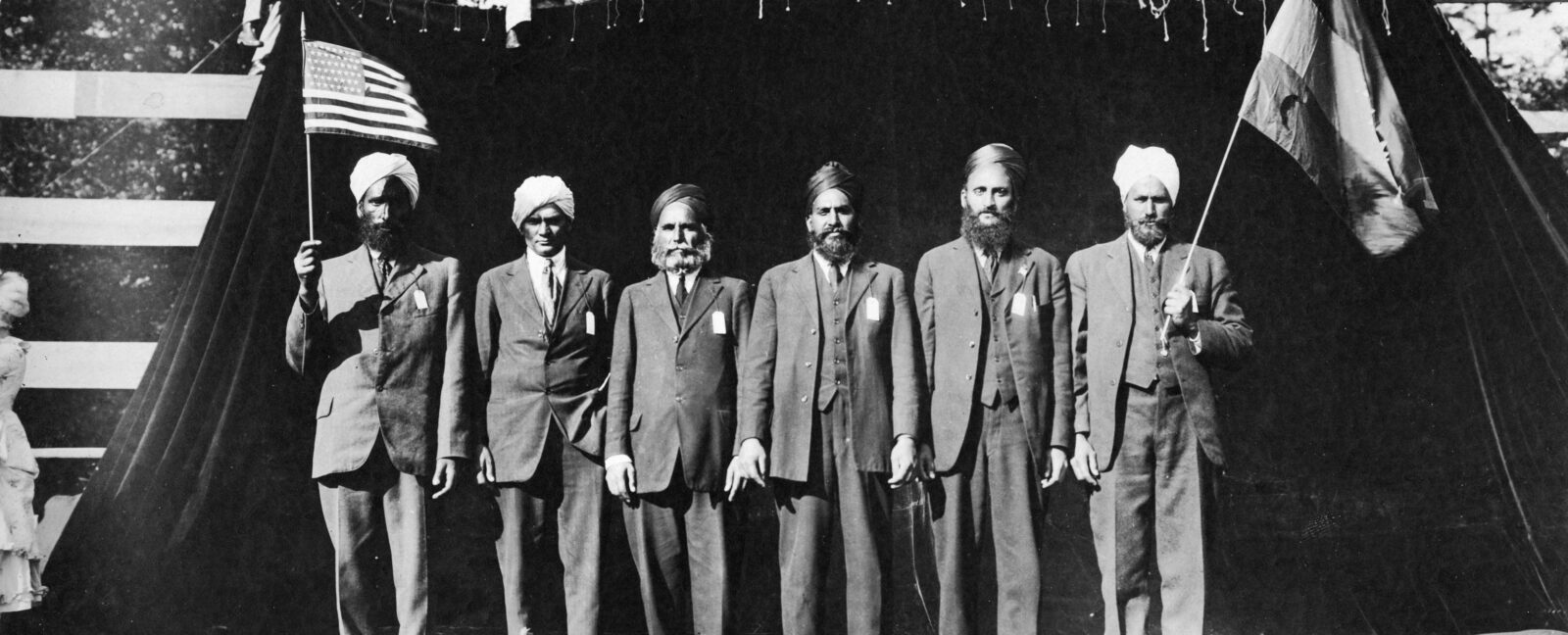 Six men in turbans performing in the "Pageant of Democracy," Woodland Park, Seattle," July 5,1920