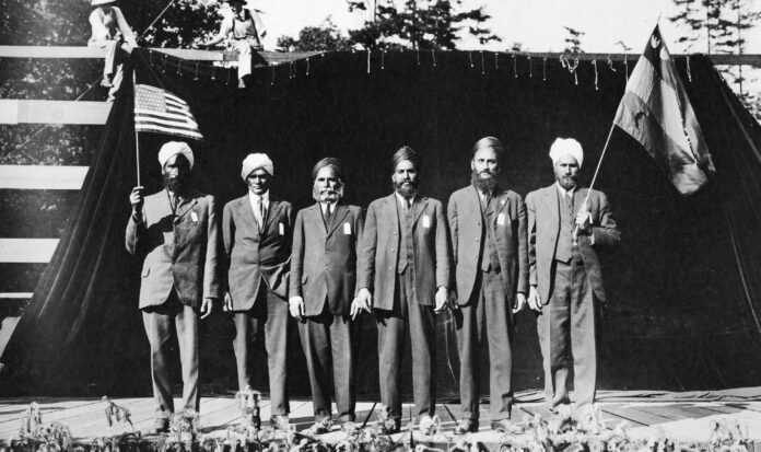 Six men in turbans performing in the "Pageant of Democracy," Woodland Park, Seattle," July 5,1920