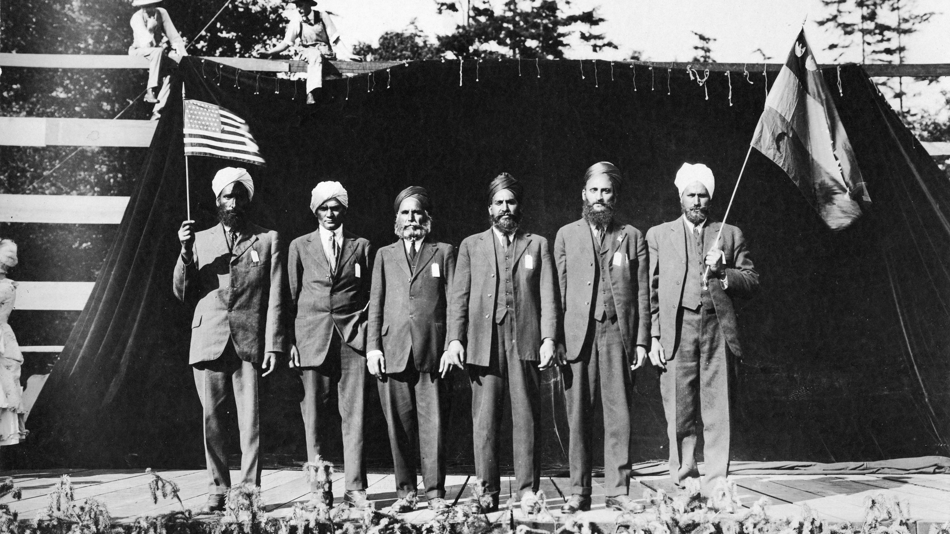 Six men in turbans performing in the "Pageant of Democracy," Woodland Park, Seattle," July 5,1920