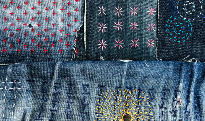 Various stitched patterns on denim fabric.
