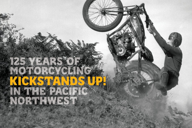 Kickstands Up! Motorcycle doing a wheelie up a dirt hill.