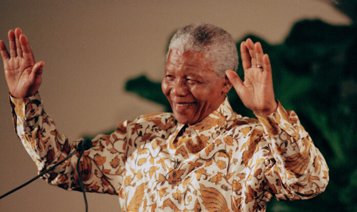 Nelson Mandela acknowledges his audience during a speech.