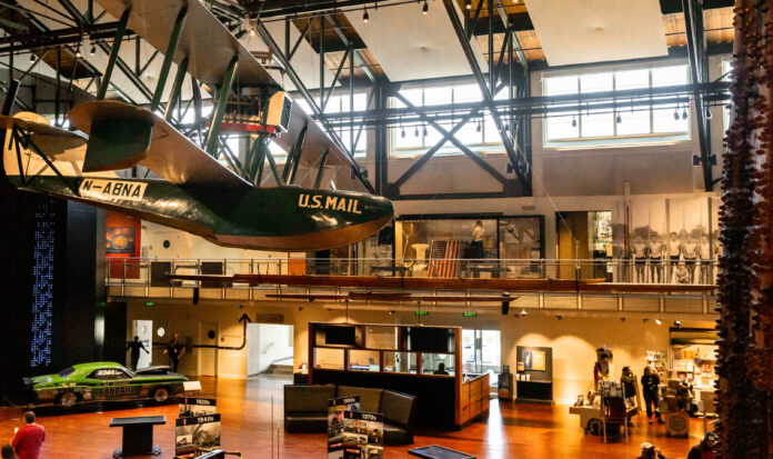 A view of the Grand Atrium at MOHAI with the Boeing B1 n the foreground and the Al Young's Dodge Charger in the background.