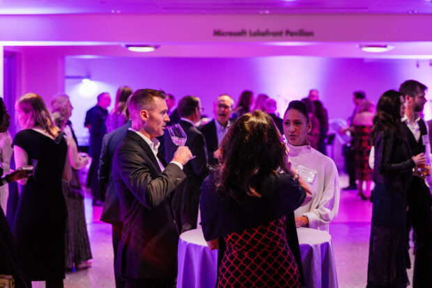 Attendees converse in the Microsoft Lakefront Pavilion during the 2024 MOHAI Gala.