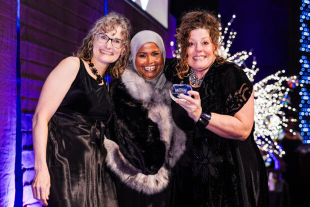 2024 MOHAI Gala attendees pose for a group photo.