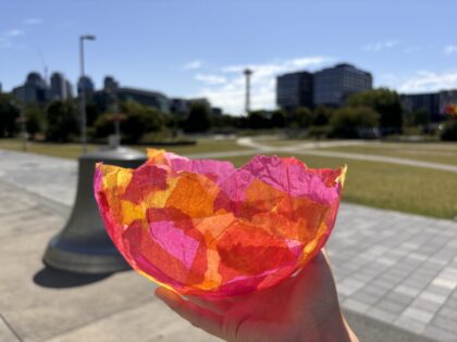 A colorful bowl made with paper mâché.