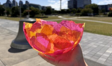 A colorful bowl made with paper mâché.