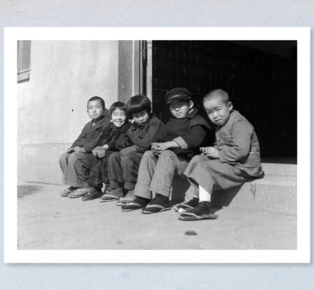 Children sitting on a doorstep in a village outside Kyoto, Japan, c. 1945.