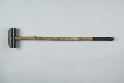 A mallet made of bamboo and metal used to play cycle polo.
