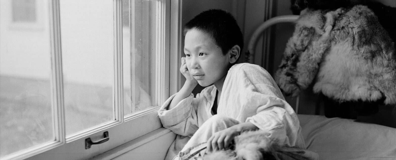Young patient looking out of window at Firland Sanatorium, Seattle, December 1, 1954
