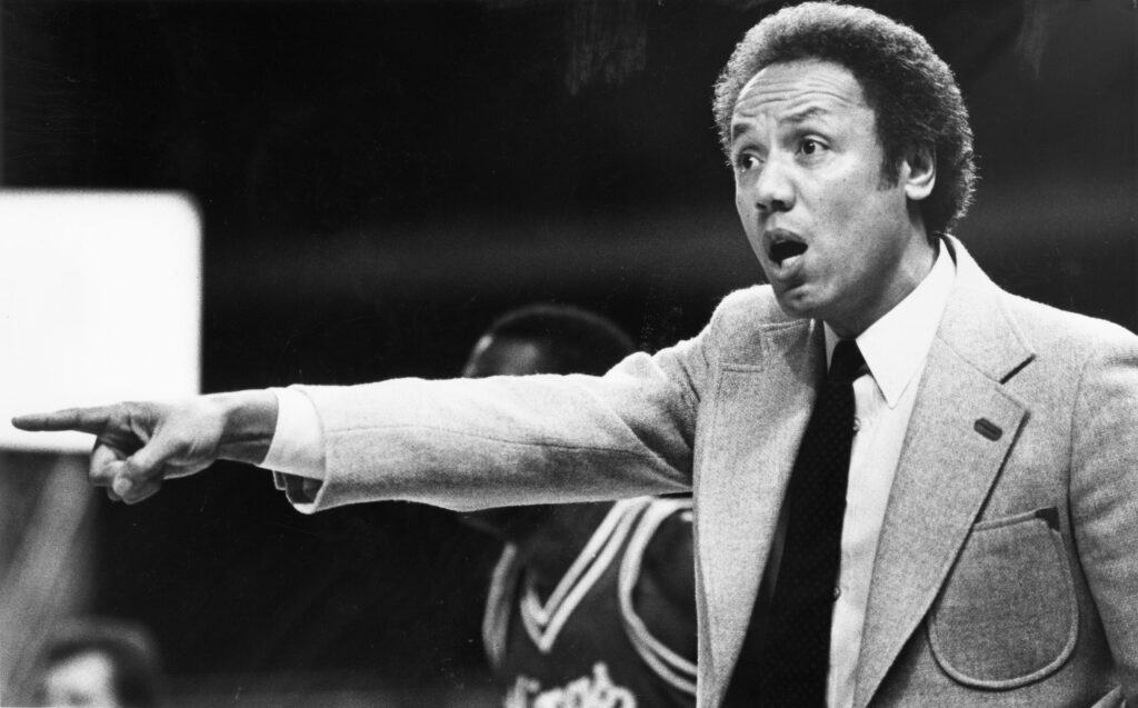 Black and white photograph of Lenny Wilkens coaching a Seattle SuperSonics game in December 1982.
