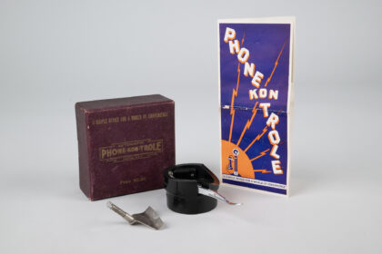 Early 1920s Phone-Kon-Trole telephone accessory invented in Seattle, shown with its original box, metal components, and illustrated instruction pamphlet reading "A Simple Device for a World of Convenience."