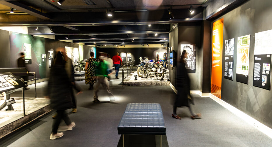 Visitors moving throughout the MOHAI Kickstands Up! exhibit in downtown Seattle, WA.
