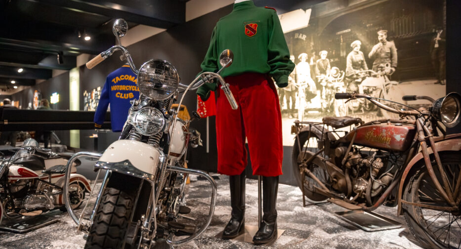 Various motorcycles and riding outfits on display at the MOHAI Kickstands Up! exhibit in downtown Seattle, WA.