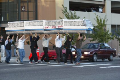 Photograph of a group of pro-monorail supporters demonstrating an alternate route to Seahawks Stadium.