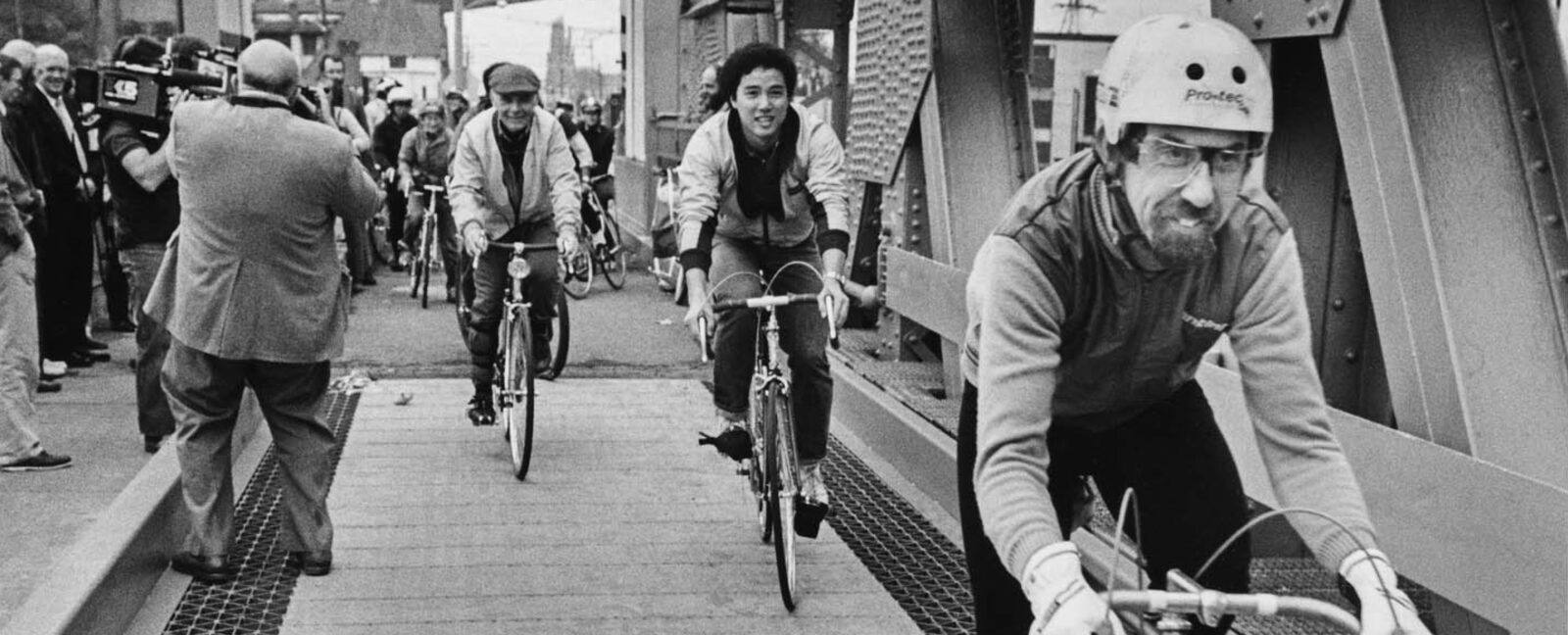Bicyclists riding on the newly finished bicycle lanes of the University Bridge, Seattle, October 12, 1983.