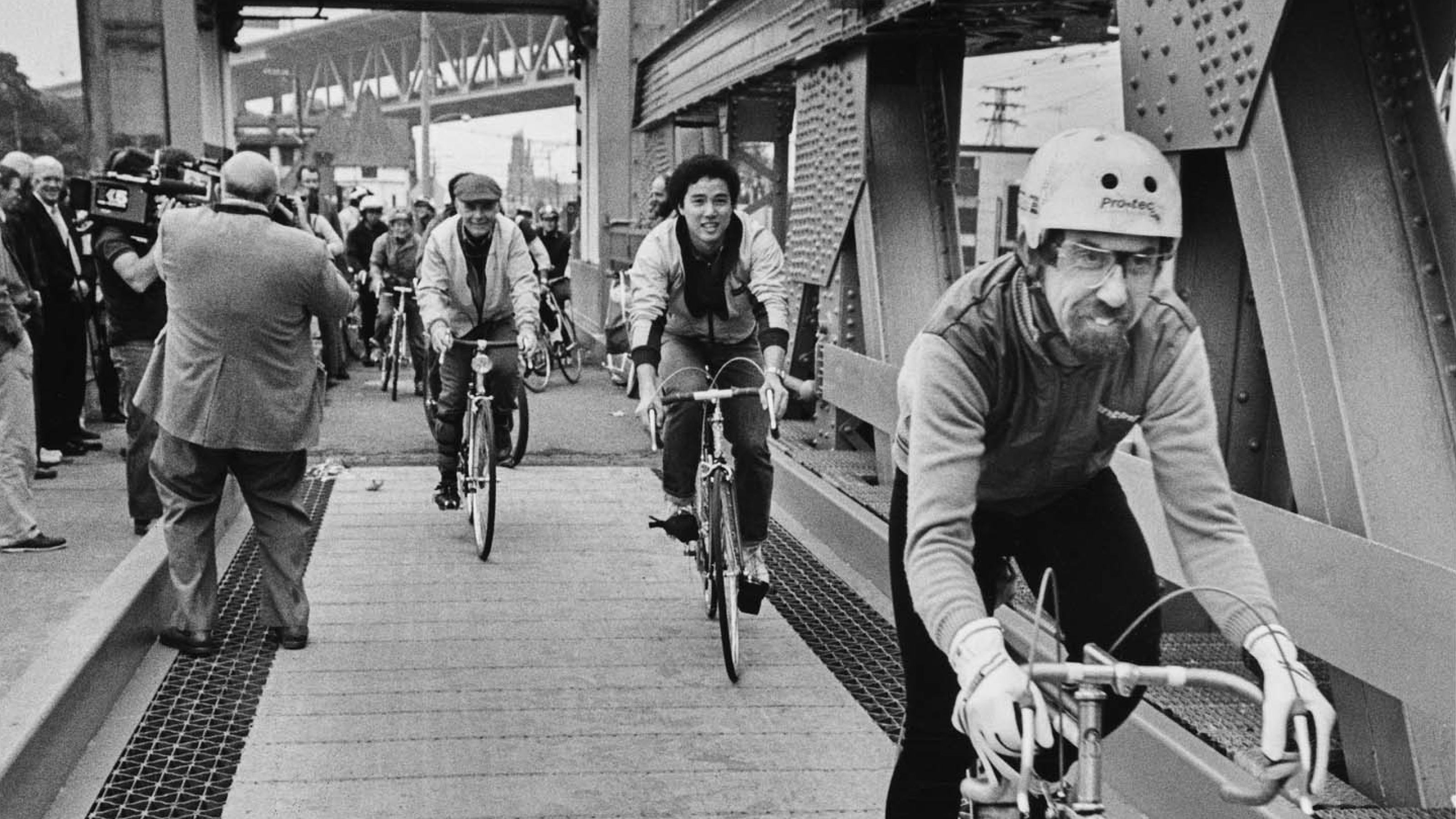 Bicyclists riding on the newly finished bicycle lanes of the University Bridge, Seattle, October 12, 1983.