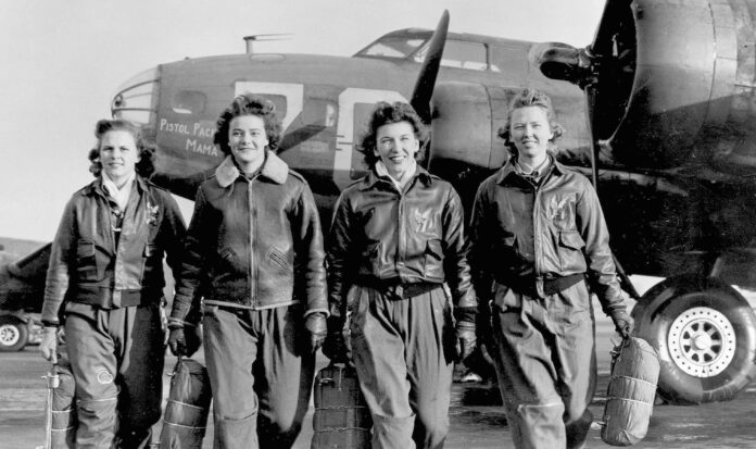 A Women's Airforce Service Pilots flight team walks from the "Pistol Packin' Mama." Photo courtesy of WASP Museum.