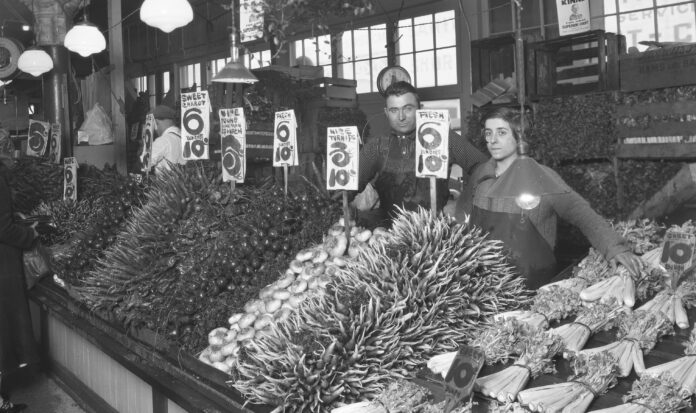 Vendors selling vegetables at Pike Place Market, November 3, 1962.